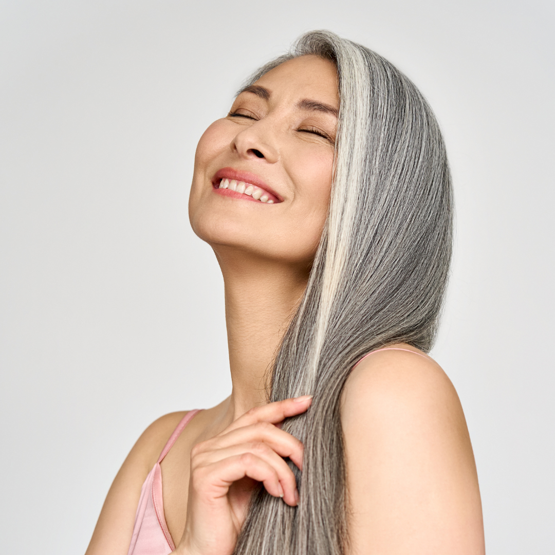 woman with grey hair smiling